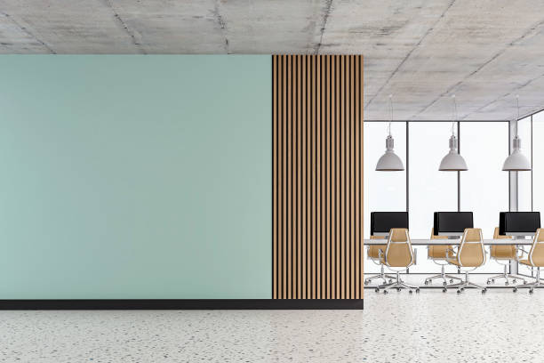 istock Empty office interior with copy space and work desks on terrazzo floor and paneled wall 1409858027