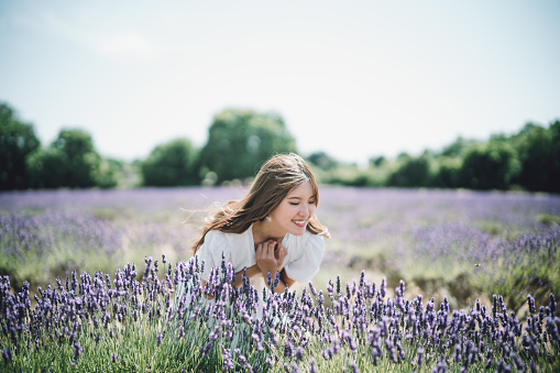 Beautiful Asian woman enjoying her day at the lavender field.