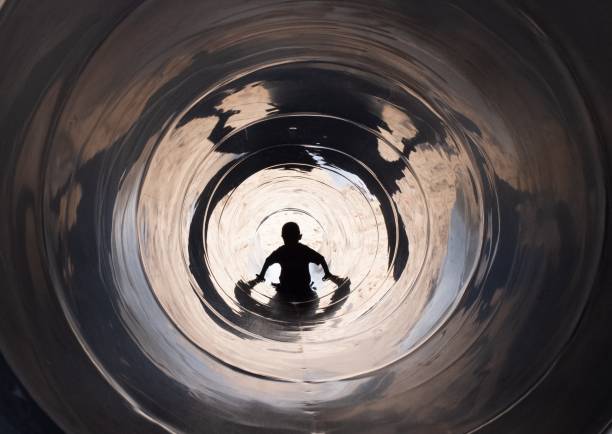 Boy walking out of the pipe at the playground