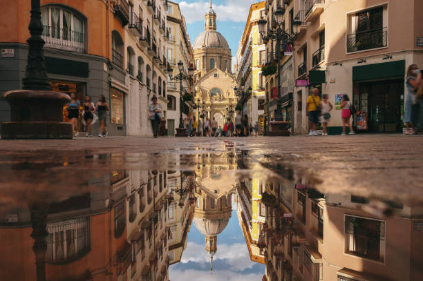 istock Street in Zaragoza and reflection 1409858651