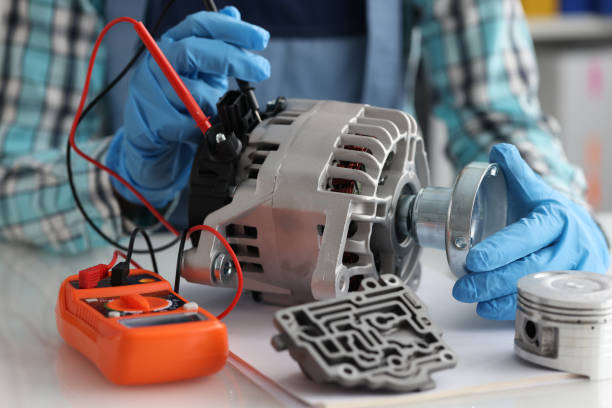 Automotive alternator repair test stator closeup with copper coil in workshop Automotive alternator repair test stator closeup with copper coil in workshop. Checking generator with multimeter concept glitch generator stock pictures, royalty-free photos & images