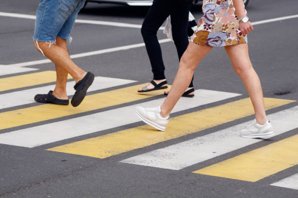 istock people crossing the road at a pedestrian crossing 1409860433