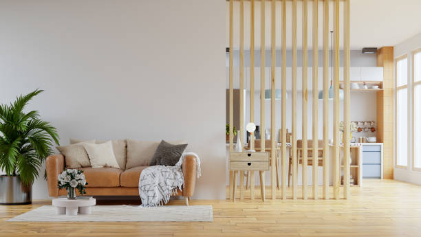 istock Living room interior wall mockup in warm tones with leather sofa which is behind the kitchen. 1409860531