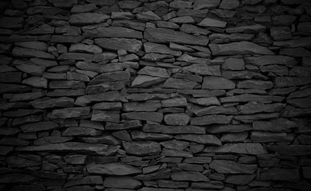 istock Dark grey brick stone wall texture background with vintage style for design art work. 1409861735