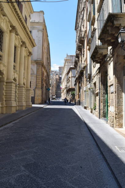 istock Narrow street in Caltagirone, Sicily, with scala 1409862158