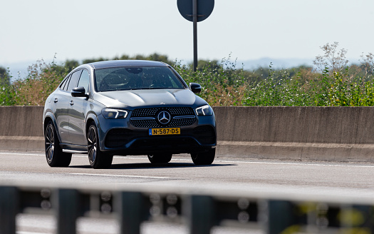 Frankfurt am Main, Hesse, Germany, july 17th 2022, close-up of a Dutch gray 2020 Mercedes-Benz, 4th generation GLE (400d 4MATIC) SUV approaching on German Autobahn A3 near Frankfurt am Main, the GLE is a luxury SUV produced by German automaker Mercedes-Benz since 1997, it was formerly known as 'M' model