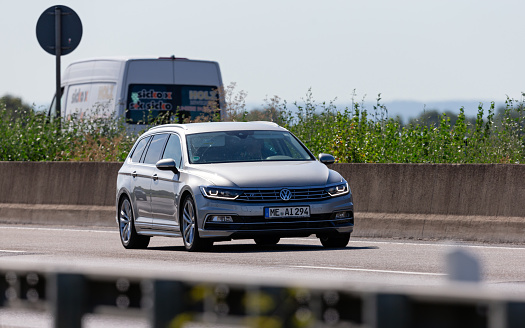 Frankfurt am Main, Hesse, Germany, july 17th 2022, close-up of a German Volkswagen, 8th generation Passat Variant approaching on German Autobahn A3 near Frankfurt am Main, the Passat is produced by German automaker Volkswagen since 1973