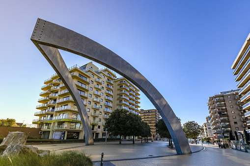 De Panne, Belgium. 15 July 2022. Tower Blocks lead to seafront in De Panne with a large street ornament.