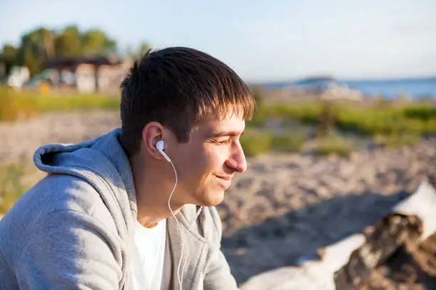Young Man listen to the Music outdoor