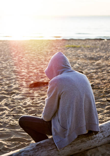 istock Lonely Young Man outdoor 1409867973