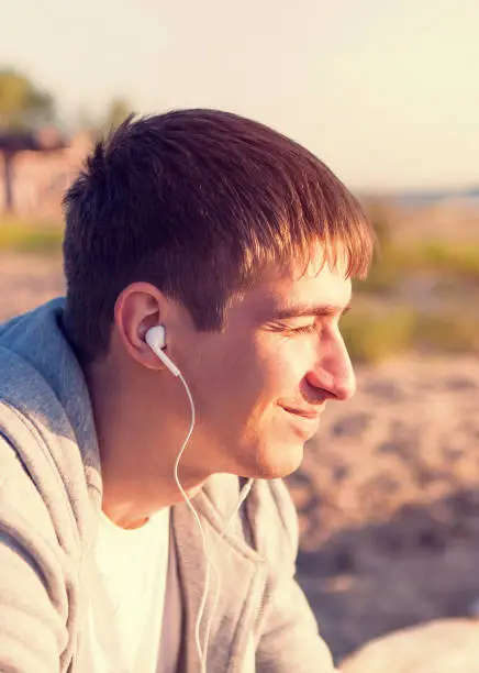 Toned Photo of Young Man listen to the Music outdoor
