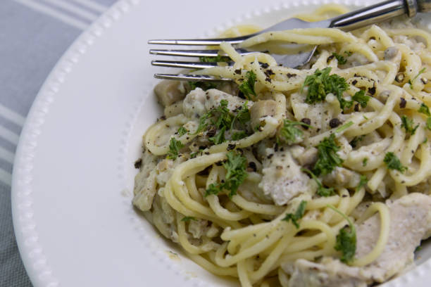 istock Spaghetti  With Truffle  Cream Sauce on White Background 1409869201