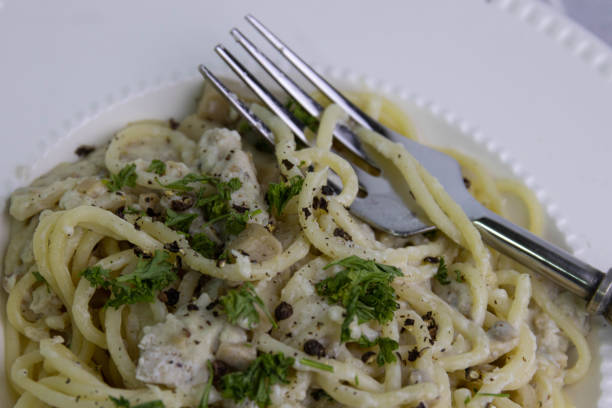 istock Spaghetti  With Truffle  Cream Sauce on White Background 1409869202