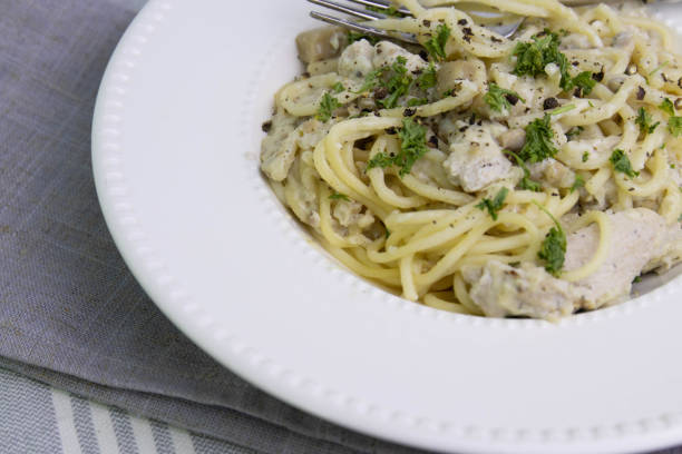 istock Spaghetti  With Truffle  Cream Sauce on White Background 1409869203