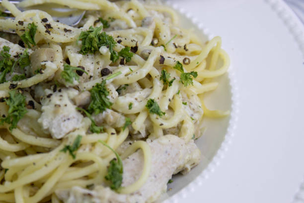 istock Spaghetti  With Truffle  Cream Sauce on White Background 1409869204