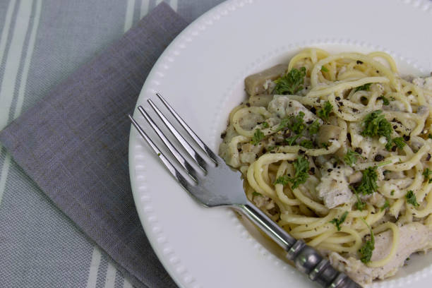 istock Spaghetti  With Truffle  Cream Sauce on White Background 1409869260