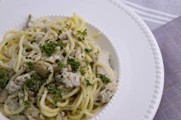 istock Spaghetti  With Truffle  Cream Sauce on White Background 1409869261