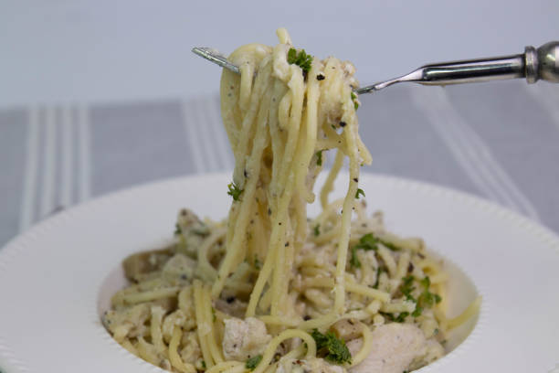 istock Spaghetti  With Truffle  Cream Sauce on White Background 1409869262