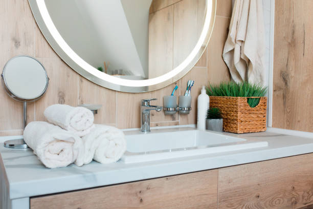 Modern bathroom interior with stylish mirror and vessel sink