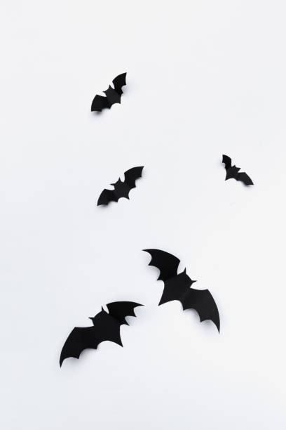 istock halloween and decoration concept - paper bats flying 1409871851