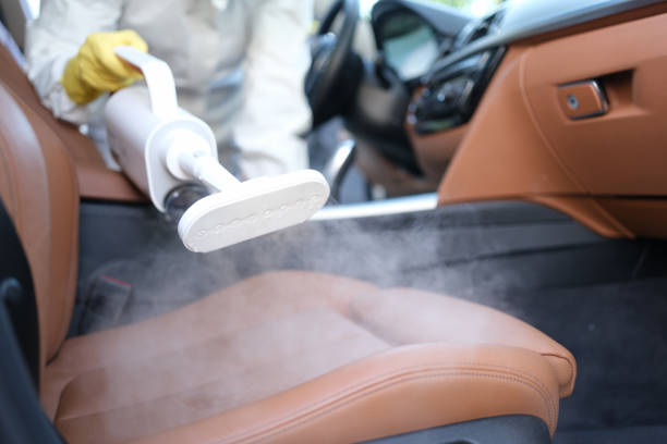 steam cleaning and disinfection of car interiors and car seats with steam cleaner - car cleaning inside of indoors imagens e fotografias de stock