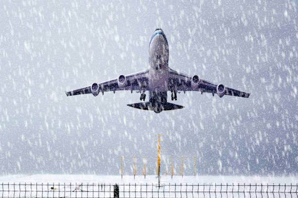 istock Passenger Plane is Taking off on Snowy ground 1409874805
