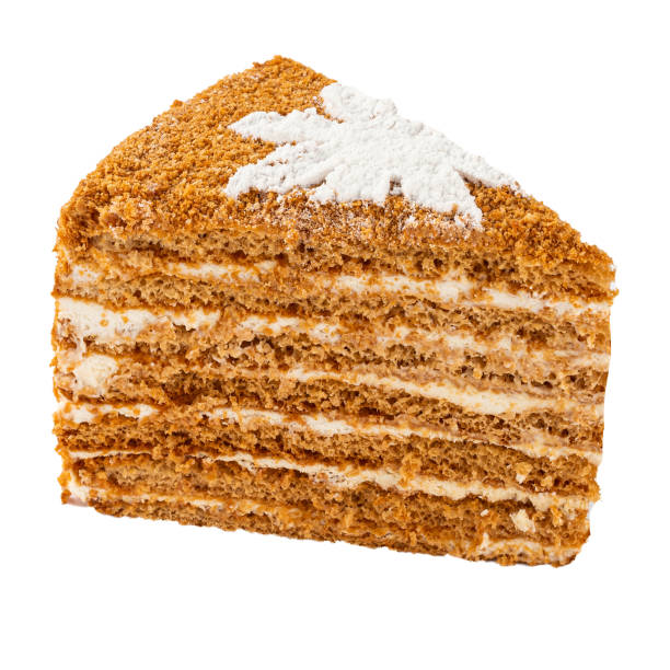 istock Isolated slice of honey cake with cream 1409875615