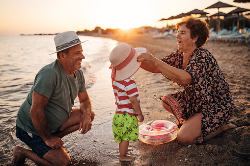 Vacation at the sea, grandfather and grandmother with grandson