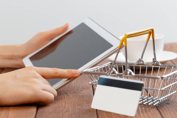 istock Woman shopping using tablet pc and credit card 1409877155