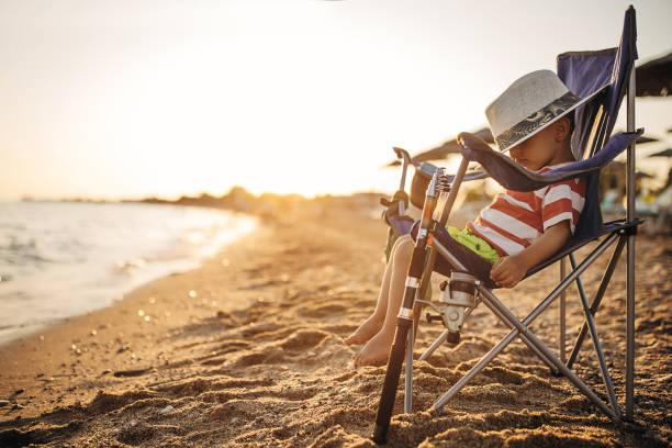 istock Fishing, child on the beach 1409877259