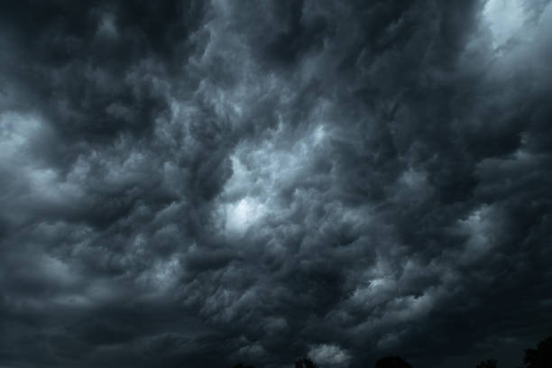 Dramatic dark clouds short before a thunderstorm and heavy rain Dramatic dark clouds short before a thunderstorm and heavy rain gale stock pictures, royalty-free photos & images