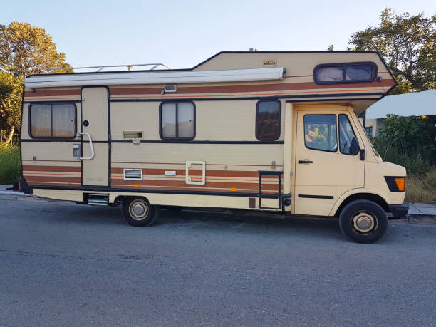 istock caravan car retro on the road in summer 1409880106