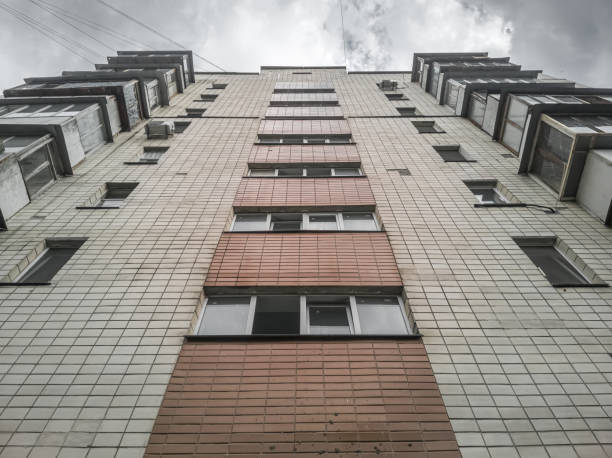 istock Facade of an apartment multistorey building. Bottom up view. 1409880631