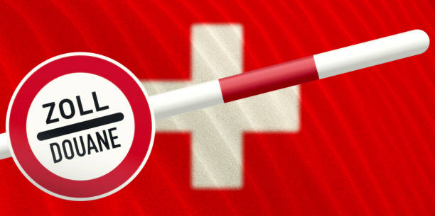 Swiss customs sign "ZOLL/DOUANE" with a barrier pole against the red Swiss flag background.