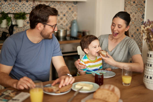 istock Parents spending some quality time with their adorable son at breakfast time 1409881824