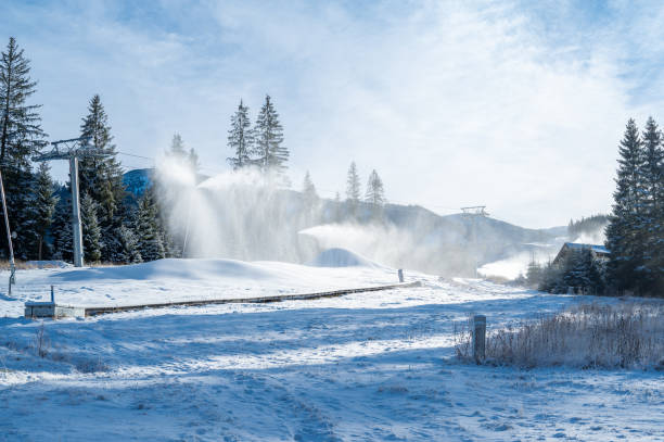 istock Snow cannon in winter mountains. Snow-gun spraying artificial ice crystals. Machine making snow. 1409882309