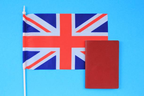 istock Passport and flag of Great Britain on blue background 1409883174