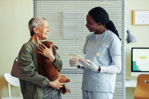 istock Happy Client in Vet Clinic 1409885423