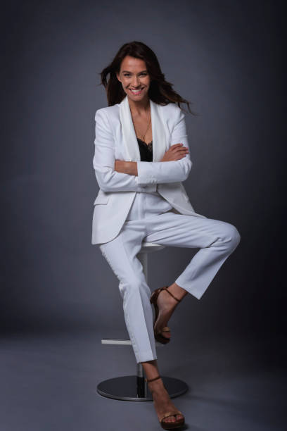 istock Attractive brown haired woman sitting at dark background 1409885549