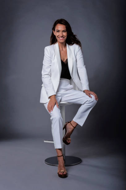 istock Attractive brown haired woman sitting at dark background 1409885558