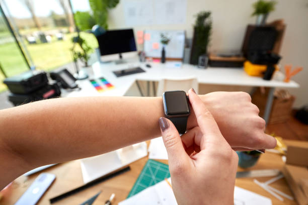 istock POV Shot Of Female Architect Working In Office Using Smart Watch 1409887538