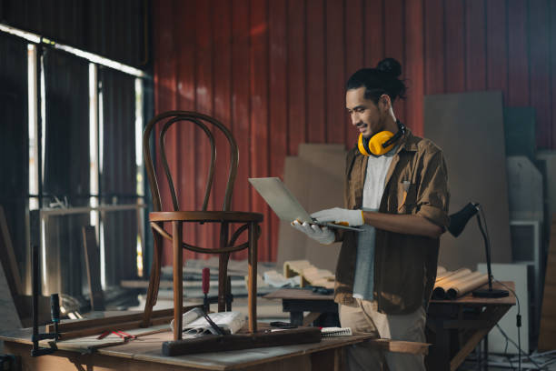 Portrait Young Asian man Carpenter in carpentry workshop