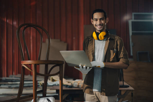 istock Portrait Young Asian man Carpenter in carpentry workshop 1409888029