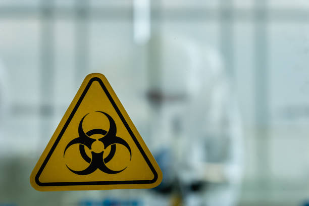 istock Lab Technician in Personal protective equipment  PPE suit Vaccines testing of Virus 1409888099