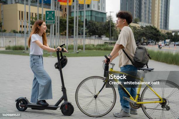 Two Young Freelancer Commuting With Environmentally Friendly Vehicles Stock Photo - Download Image Now