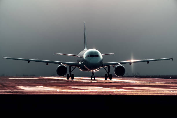 commercial airplane preparing for takeoff on the runway, front view