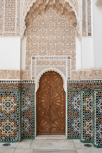 Old ancient door architecture on a traditional landmark in Marrakesh, Morocco