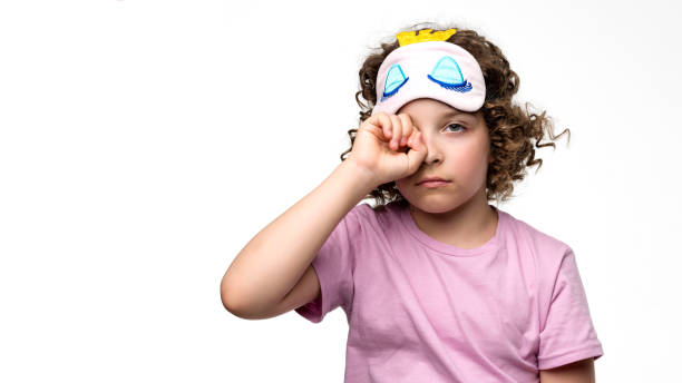 istock Sleepy child rubbing her eyes 1409891466
