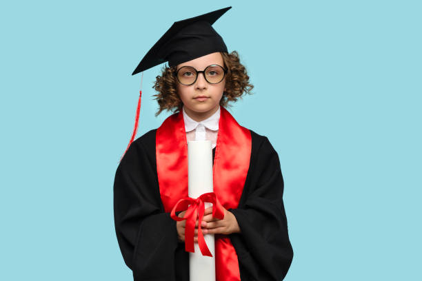 istock Schoolgirl Celebrating Graduation 1409891473