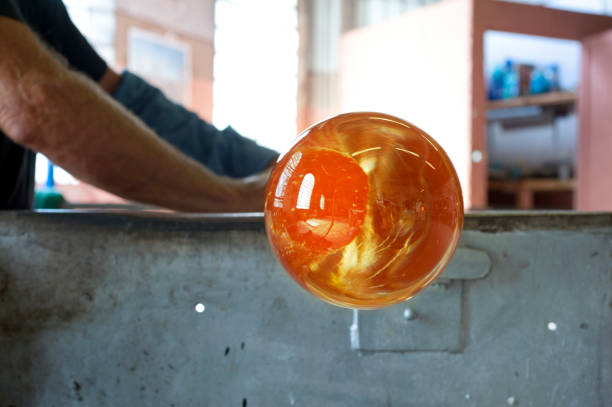 Crafting a glass sphere stock photo